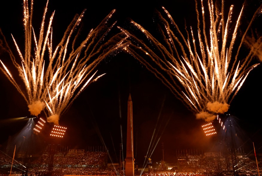 General view of the torch relay performance as the Obelisk of Luxor on the Place de la Concorde is seen during the opening ceremony.