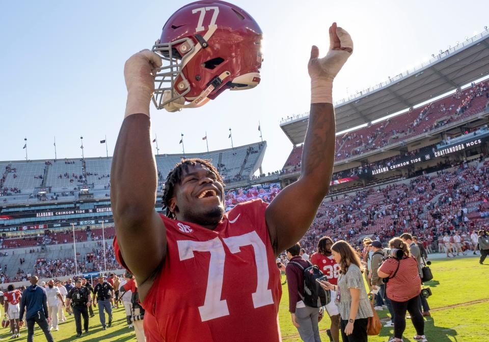 Nov 18, 2023; Tuscaloosa, Alabama, USA; Alabama Crimson Tide offensive lineman Jaeden Roberts (77) celebrates after defeating the Chattanooga Mocs at Bryant-Denny Stadium. Alabama won 66-10. Mandatory Credit: Gary Cosby Jr.-USA TODAY Sports