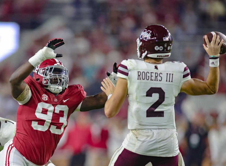 TUSCALOOSA, AL - OCTOBER 22: Jah-Marien Latham #93 of the Alabama Crimson Tide pressures Will Rogers #2 of the Mississippi State Bulldogs during the second half at Bryant-Denny Stadium on October 22, 2022 in Tuscaloosa, Alabama. (Photo by Brandon Sumrall/Getty Images)