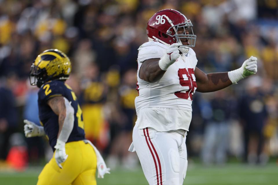 PASADENA, CALIFORNIA - JANUARY 01: Tim Keenan III #96 of the Alabama Crimson Tide celebrates in the fourth quarter against the Michigan Wolverines during the CFP Semifinal Rose Bowl Game at Rose Bowl Stadium on January 01, 2024 in Pasadena, California. (Photo by Harry How/Getty Images)