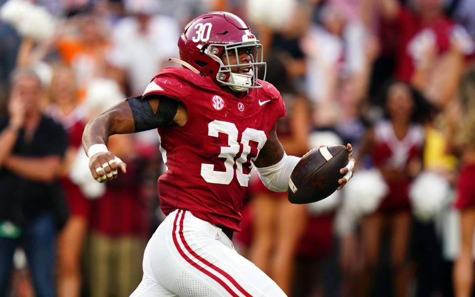 Oct 21, 2023; Tuscaloosa, Alabama, USA; Alabama Crimson Tide linebacker Jihaad Campbell (30) picks up a fumble and ran it back for a touchdown against the Tennessee Volunteers during the second half at Bryant-Denny Stadium. Mandatory Credit: John David Mercer-USA TODAY Sports