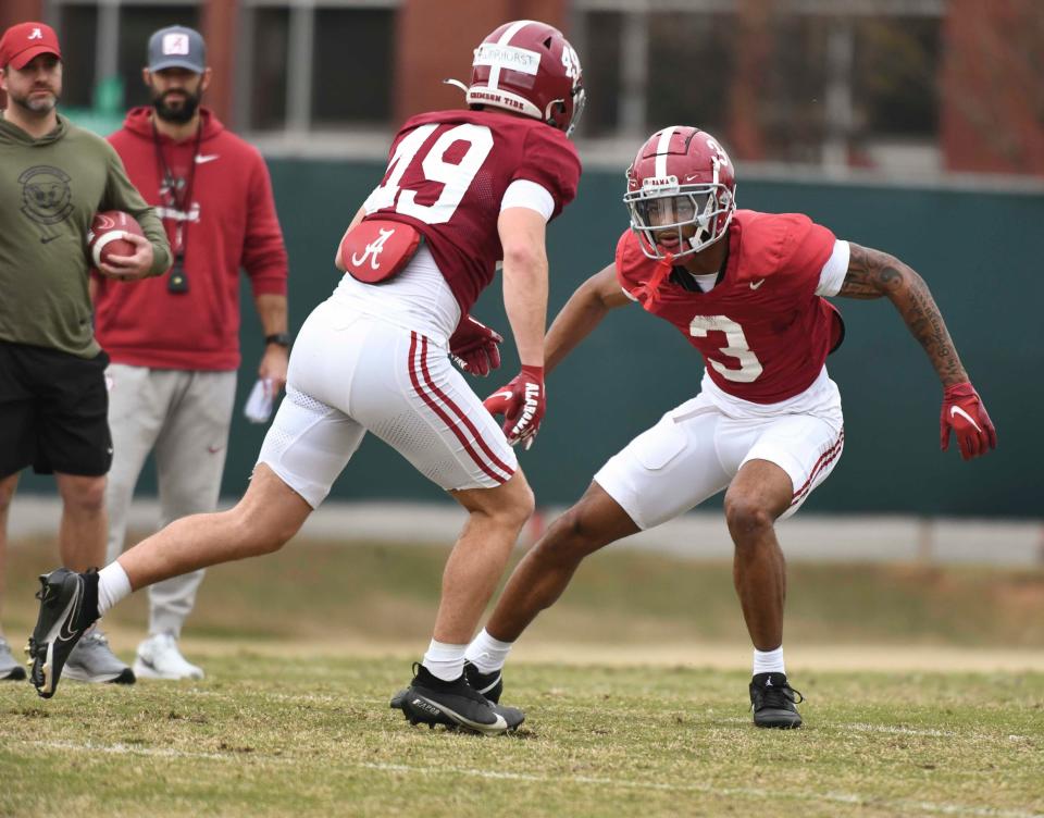 Mar 21, 2024; Tuscaloosa, Alabama, USA; Defensive backs Conner Warhurst (49) and Keon Sabb (3) work during practice at the University Alabama Thursday.