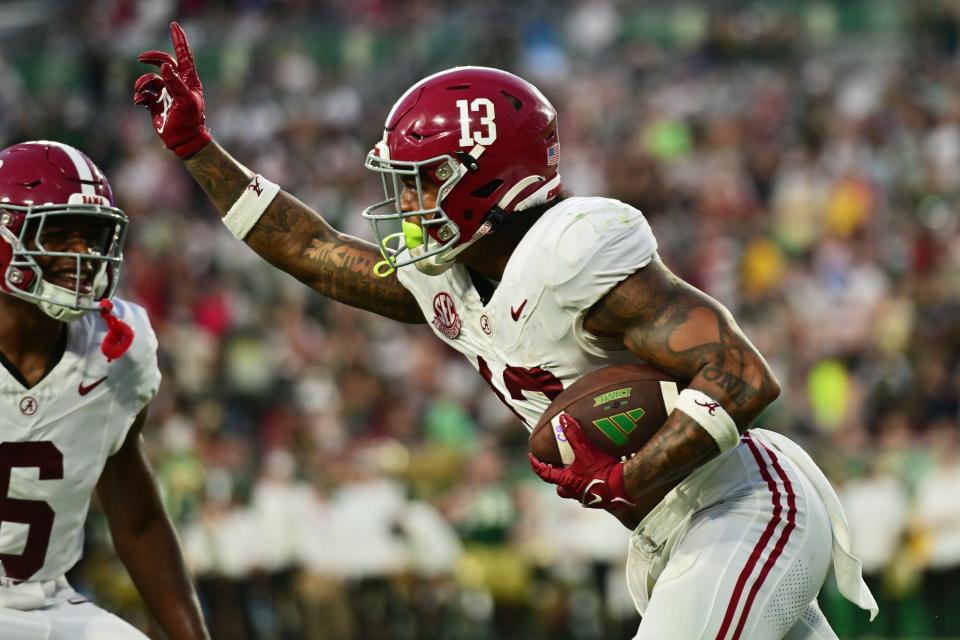 TAMPA, FLORIDA - SEPTEMBER 16: Malachi Moore #13 of the Alabama Crimson Tide reacts after intercepting a ball from the South Florida Bulls in the fourth quarter at Raymond James Stadium on September 16, 2023 in Tampa, Florida. (Photo by Julio Aguilar/Getty Images)