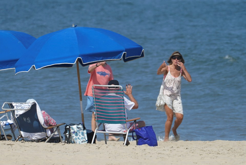 A passerby blew kisses to Biden on the beach