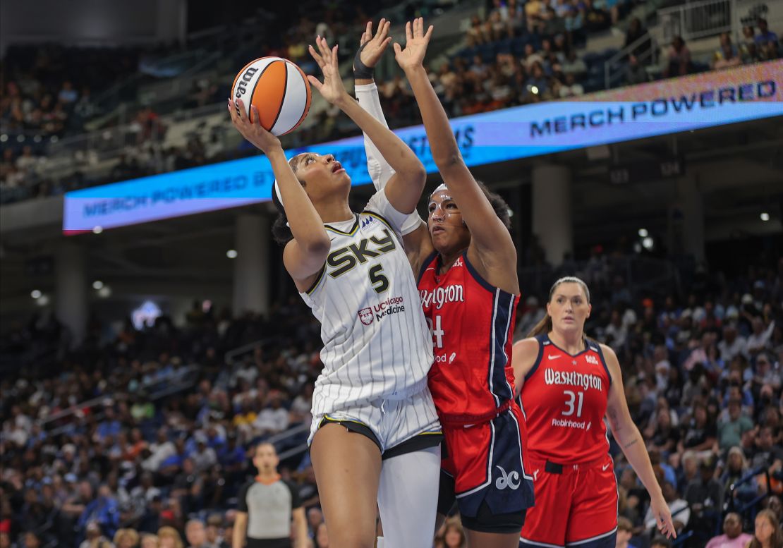 CHICAGO, IL - AUGUST 28: Angel Reese #5 of the Chicago Sky drives to the basket for a layup against Aaliyah Edwards #24 of the Washington Mystics during the first half of a WNBA game on August 28, 2024 at Wintrust Arena in Chicago, Illinois. (Photo by Melissa Tamez/Icon Sportswire via Getty Images)