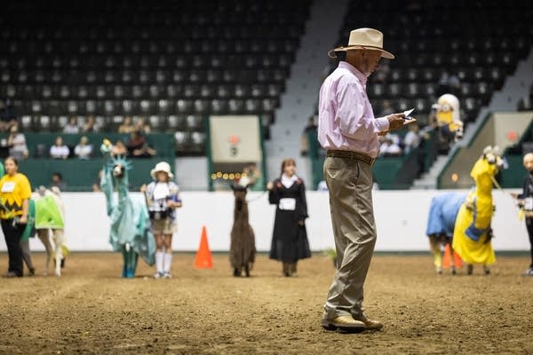 A man revies his notes in an arena