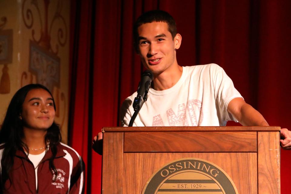 Senior Jonathan Kang, a member of the Ossining High School marching band, speaks as fellow band member Nathalia Santacruz, also a senior, looks on during the back to school staff assembly at Ossining High School Aug. 28, 2024. The Ossining High School's marching band has been invited to perform in the Pearl Harbor Memorial Parade in Hawaii on December 7, 2024.