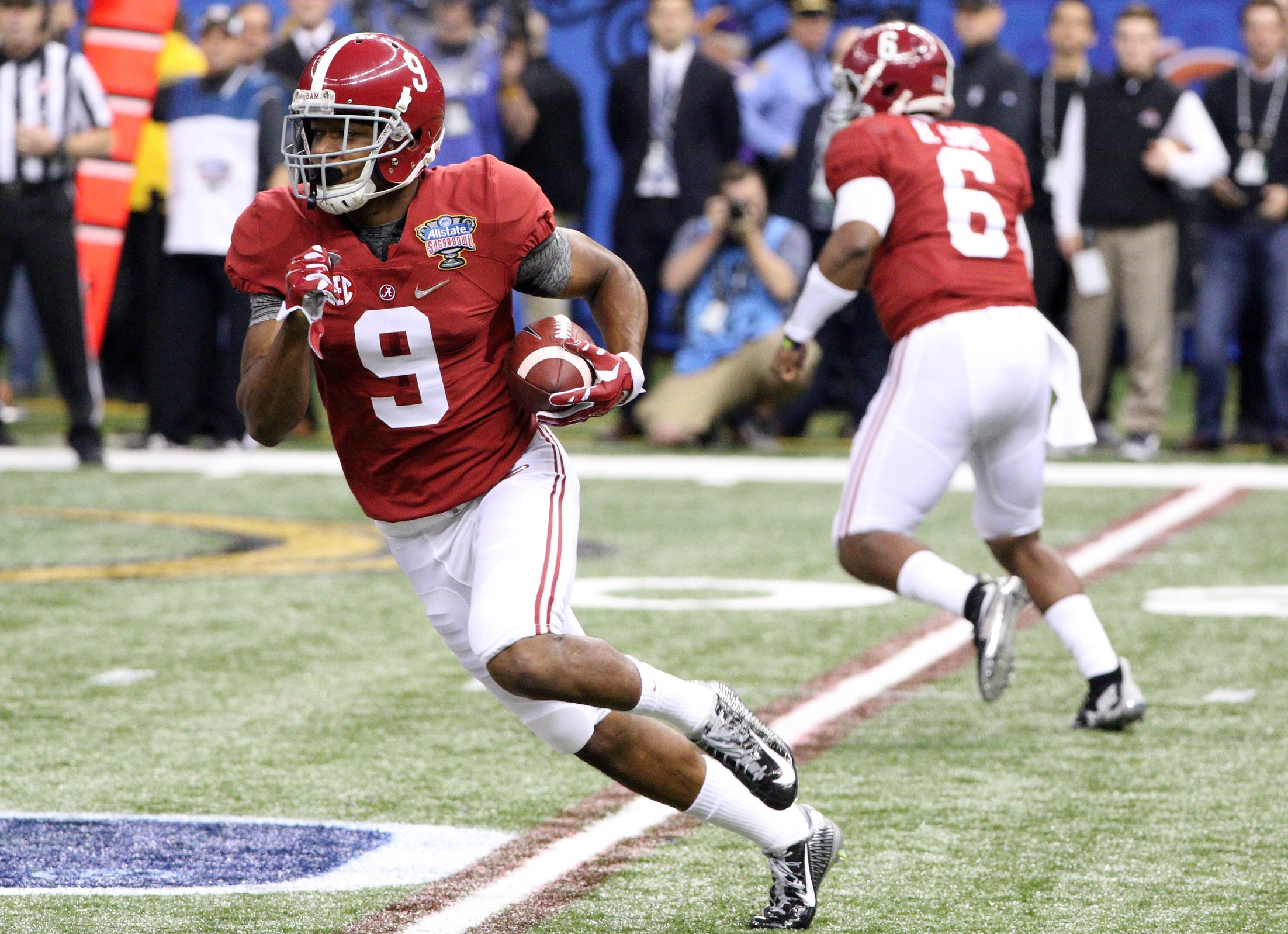 Jan 1, 2015; New Orleans, LA, USA; Alabama Crimson Tide wide receiver Amari Cooper (9) runs the ball during the first quarter of the 2015 Sugar Bowl against the Ohio State Buckeyes at Mercedes-Benz Superdome. Mandatory Credit: Derick E. Hingle-USA TODAY Sports