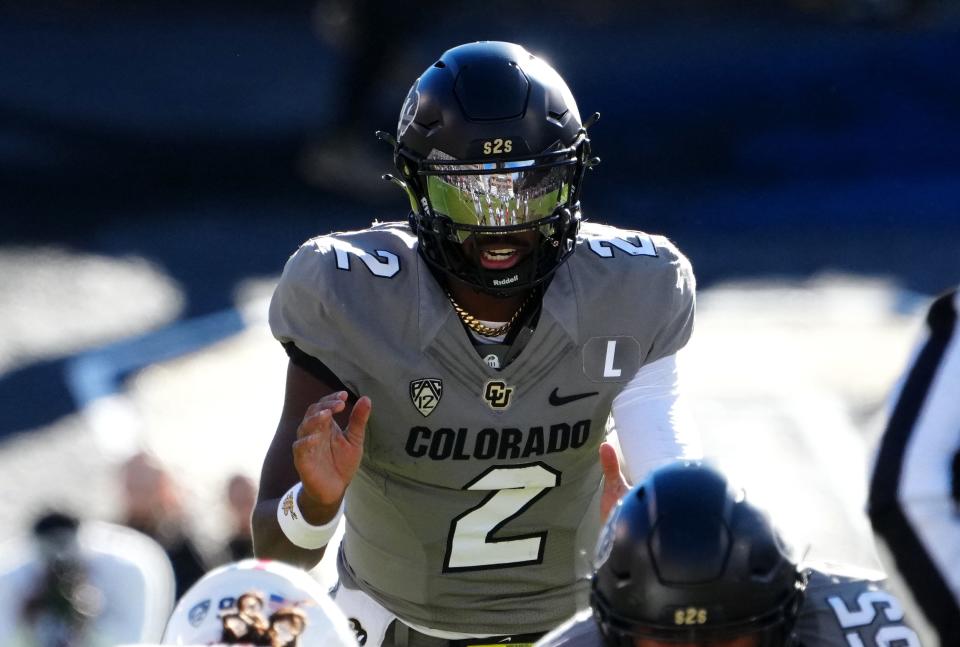 Nov 11, 2023; Boulder, Colorado, USA; Colorado Buffaloes quarterback Shedeur Sanders (2) at the line of scrimmage in the first half against the Arizona Wildcats at Folsom Field. Mandatory Credit: Ron Chenoy-USA TODAY Sports