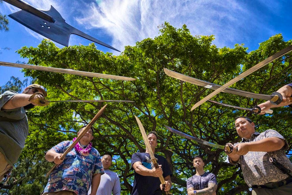 The activists present their weapons in Honolulu.