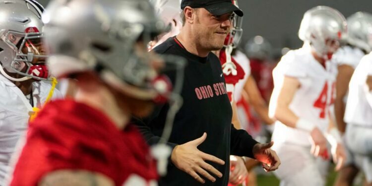 Mar 5, 2024; Columbus, OH, USA; Ohio State Buckeyes offensive line coach Justin Frye works with the team during the first spring practice at the Woody Hayes Athletic Center.