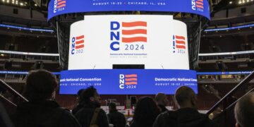 The logo for the 2024 Democratic National Convention is displayed on the scoreboard during the DNC Winter Media Walkthrough at the United Center, Thursday, Jan. 18.