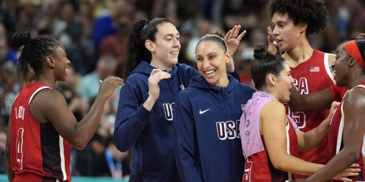 Aug 4, 2024; Villeneuve-d'Ascq, France; Team United States celebrates after defeating Germany in a women’s group C game during the Paris 2024 Olympic Summer Games at Stade Pierre-Mauroy.