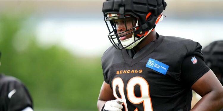 Jul 28, 2023; Cincinnati, Ohio, USA; Cincinnati Bengals defensive end Myles Murphy (99) jogs between drills during training camp at the practice fields next to Paycor Stadium. Mandatory Credit: Kareem Elgazzar/The Cincinnati Enquirer-USA TODAY Sports