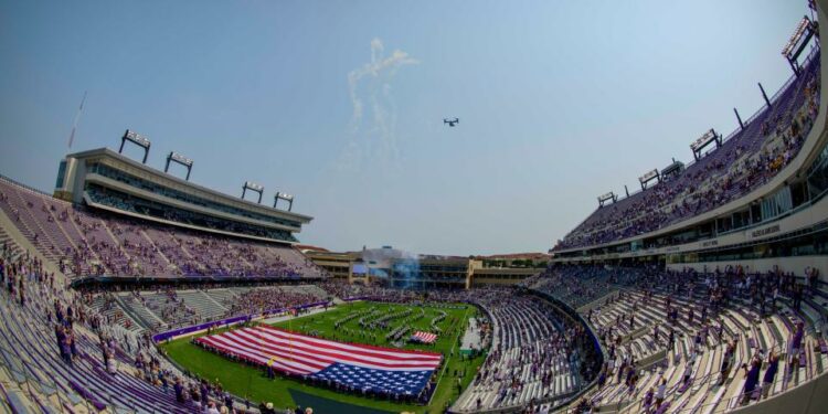 Sep 11, 2021; Fort Worth, Texas, USA; A view of the American flag and the fans and the field and the marching band and the fans as an Osprey airplane performs a flyover before the game between the TCU Horned Frogs and the California Golden Bears at Amon G. Carter Stadium. Mandatory Credit: Jerome Miron-USA TODAY Sports