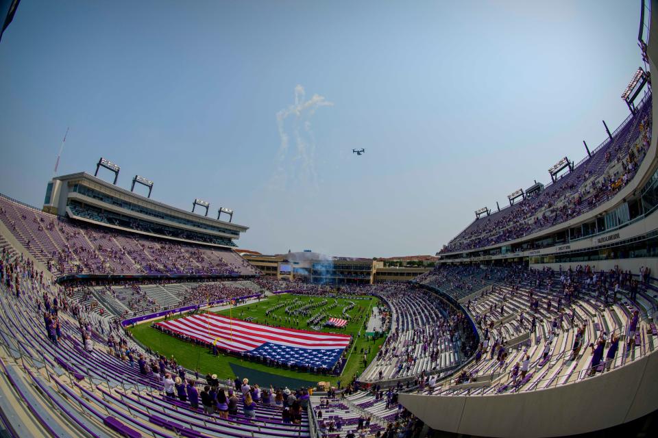 Sep 11, 2021; Fort Worth, Texas, USA; A view of the American flag and the fans and the field and the marching band and the fans as an Osprey airplane performs a flyover before the game between the TCU Horned Frogs and the California Golden Bears at Amon G. Carter Stadium. Mandatory Credit: Jerome Miron-USA TODAY Sports