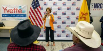 Republican U.S. House candidate Yvette Herrell speaking into a microphone at a campaign event in Las Cruces, New Mexico in 2024