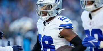 Nov 19, 2023; Charlotte, North Carolina, USA;  Dallas Cowboys cornerback DaRon Bland (26) celebrates his score against the Carolina Panthers during the second half at Bank of America Stadium. Mandatory Credit: Jim Dedmon-USA TODAY Sports