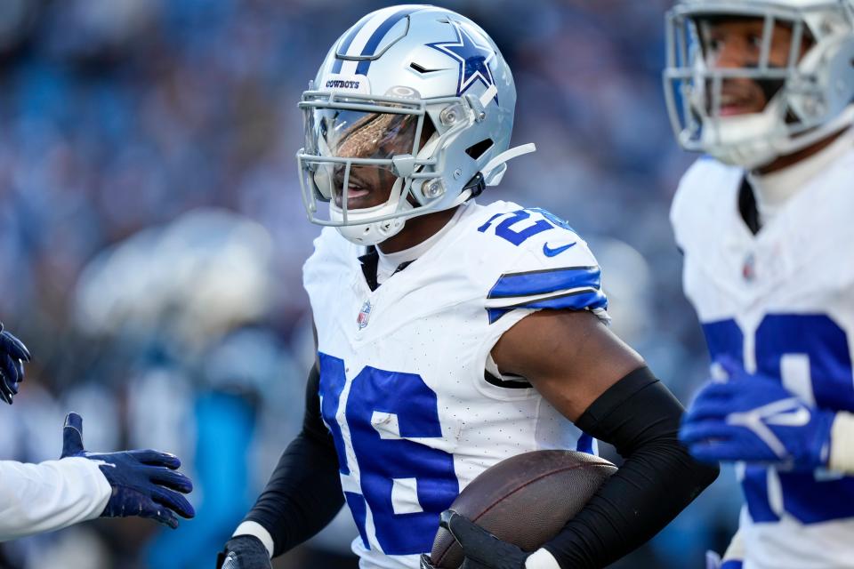 Nov 19, 2023; Charlotte, North Carolina, USA;  Dallas Cowboys cornerback DaRon Bland (26) celebrates his score against the Carolina Panthers during the second half at Bank of America Stadium. Mandatory Credit: Jim Dedmon-USA TODAY Sports