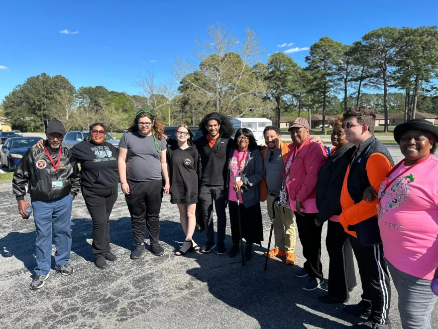 Lesene, pictured second from left, alongside a group of community health ambassadors from Shackle Free.