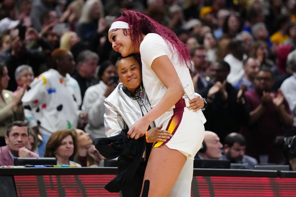 Apr 7, 2024; Cleveland, OH, USA; South Carolina Gamecocks center Kamilla Cardoso (10) embraces head coach Dawn Staley in the fourth quarter against the Iowa Hawkeyes in the finals of the Final Four of the womens 2024 NCAA Tournament at Rocket Mortgage FieldHouse. Mandatory Credit: Kirby Lee-USA TODAY Sports ORG XMIT: IMAGN-742941 ORIG FILE ID: 20240407_lbm_al2_142.JPG