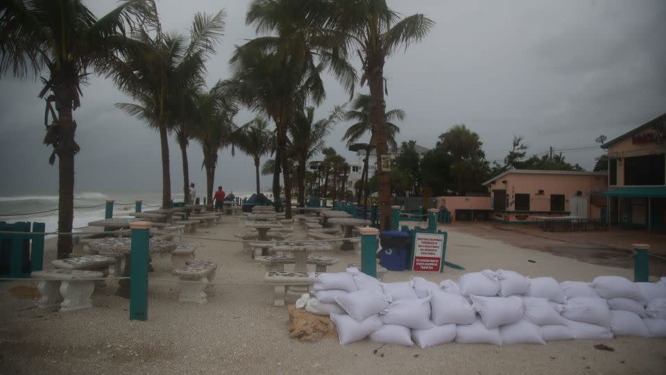 Sandbags are lined up near Bonita Beach in Bonita Springs, Florida, on Sunday, August 4, 2024. - Andrew West/The News-Press/USA Today Network