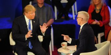 Donald Trump (left) and Anderson Cooper talk during the CNN town hall on Tuesday, March 29, 2016 at the Riverside Theater in Milwaukee. The CNN town hall was with the three remaining Republican presidential hopefuls: Texas Sen. Ted Cruz, Ohio Gov. John Kasich and Donald Trump.