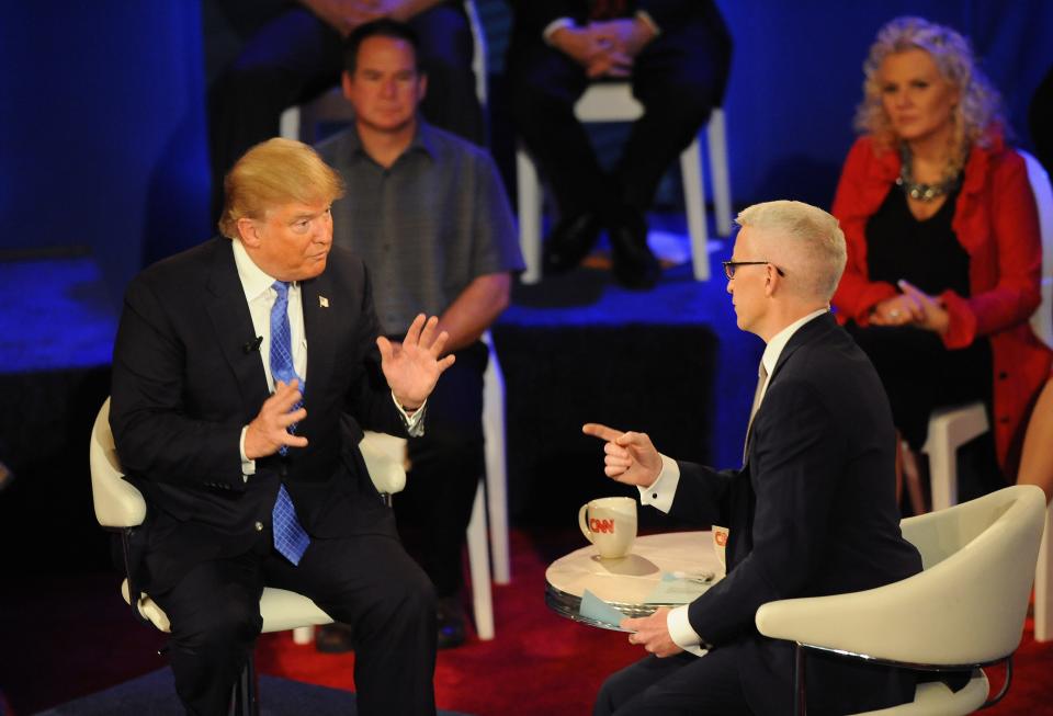 Donald Trump (left) and Anderson Cooper talk during the CNN town hall on Tuesday, March 29, 2016 at the Riverside Theater in Milwaukee. The CNN town hall was with the three remaining Republican presidential hopefuls: Texas Sen. Ted Cruz, Ohio Gov. John Kasich and Donald Trump.