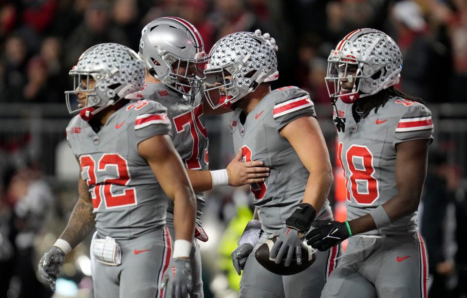 Nov 11, 2023; Columbus, Ohio, USA; Ohio State Buckeyes tight end Cade Stover (8) is congratulated by Ohio State Buckeyes offensive lineman Carson Hinzman (75) on his touchdown during the NCAA football game against Michigan State University at Ohio Stadium.