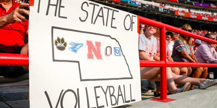 Aug 30, 2023; Lincoln, NE, USA; A volleyball sign hangs in the stands before the game between the Nebraska Cornhuskers and the Omaha Mavericks at Memorial Stadium. Mandatory Credit: Dylan Widger-USA TODAY Sports