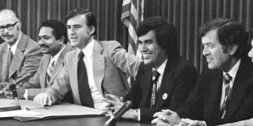 A happy California Gov. Edmund G. Brown Jr. with Lt. Gov. Mervyn Dymally, left, gave Assemblyman Richard Alatorre, a pat on the back as he talked to reporters following his signing of a landmark farm labor bill at the Capitol in Sacramento on Thursday, June 6, 1975. The bill takes effect Aug. 28 and will allow state-supervised secret ballot farm labor elections during two key fall agriculture harvests. Alatorre was one of the chief authors of farm labor legislation. (AP Photo)