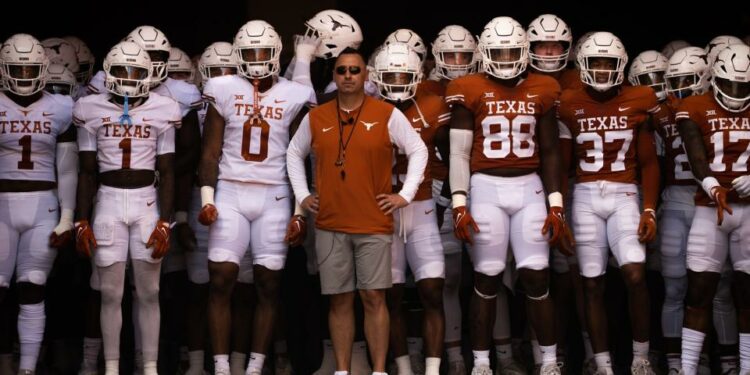 The Texas teams, with Head Coach Steve Steve Sarkisian, line up to run out of the tunnel ahead of the Longhorn's Orange and White spring football game in Darrell K Royal-Texas Memorial Stadium, Saturday, April 15, 2023.