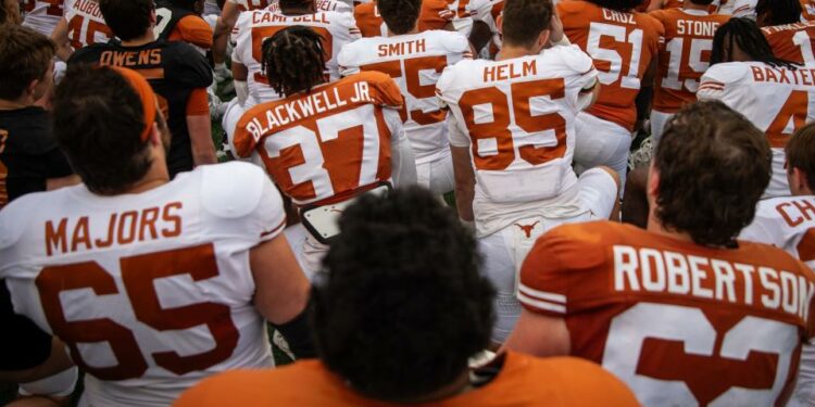 Texas players take the field at Royal-Memorial Stadium ahead of the April 20 Orange-White scrimmage. On Saturday, the Longhorns will step out for the real thing in their season opener against Colorado State.