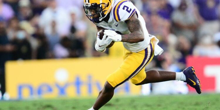 Sep 4, 2021; Pasadena, California, USA; Louisiana State Tigers wide receiver Koy Moore (2) runs the ball against the UCLA Bruins during the first half the at the Rose Bowl. Mandatory Credit: Gary A. Vasquez-USA TODAY Sports