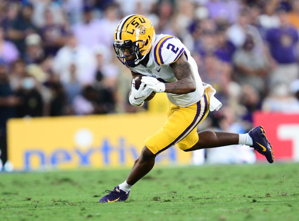 Sep 4, 2021; Pasadena, California, USA; Louisiana State Tigers wide receiver Koy Moore (2) runs the ball against the UCLA Bruins during the first half the at the Rose Bowl. Mandatory Credit: Gary A. Vasquez-USA TODAY Sports