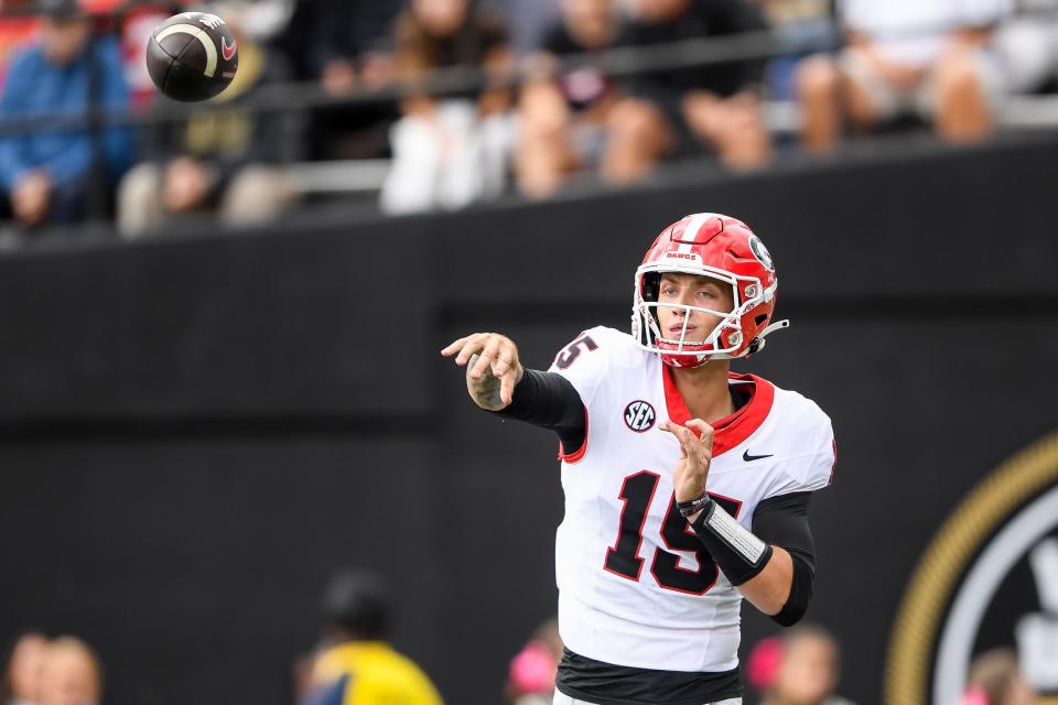 Oct 14, 2023; Nashville, Tennessee, USA; Georgia Bulldogs quarterback Carson Beck (15) throws a pass against the Vanderbilt Commodores during the second half at FirstBank Stadium. Mandatory Credit: Steve Roberts-USA TODAY Sports