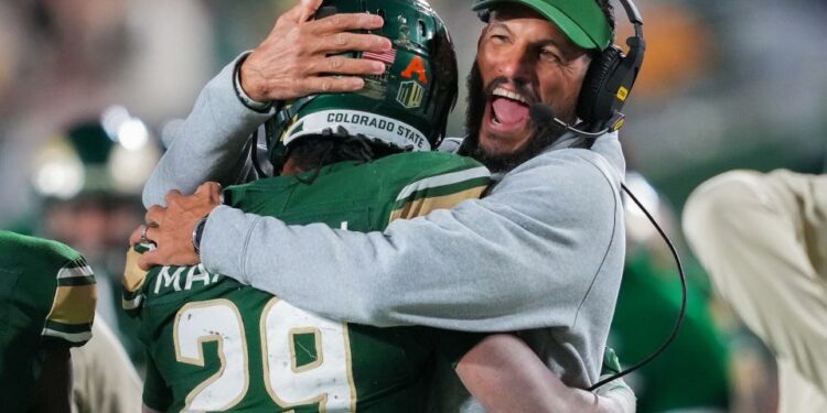 Nov 11, 2023; Fort Collins, Colorado, USA; Colorado State Rams head coach Jay Norvell celebrates a touchdown with running back Justin Marshall (29) during the third quarter against the San Diego State Aztecs at Sonny Lubick Field at Canvas Stadium. Mandatory Credit: Andrew Wevers-USA TODAY Sports