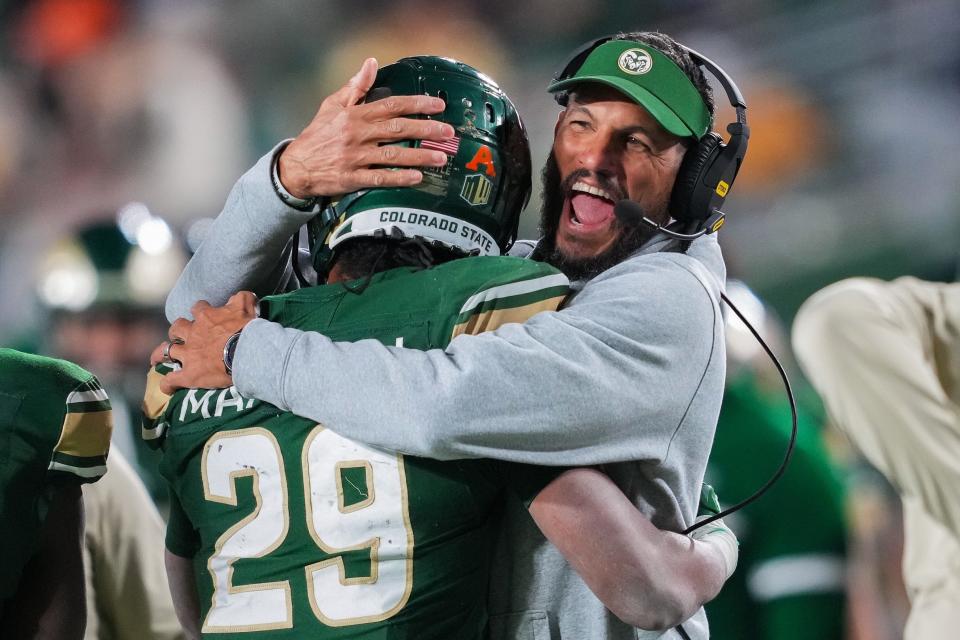 Nov 11, 2023; Fort Collins, Colorado, USA; Colorado State Rams head coach Jay Norvell celebrates a touchdown with running back Justin Marshall (29) during the third quarter against the San Diego State Aztecs at Sonny Lubick Field at Canvas Stadium. Mandatory Credit: Andrew Wevers-USA TODAY Sports