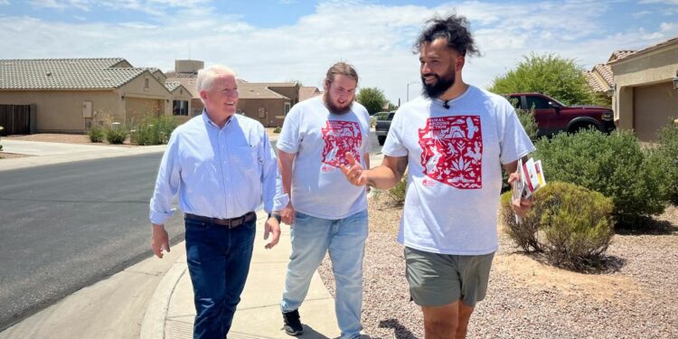 John King walks with Rural Arizona Action members in Pinal County, Arizona.