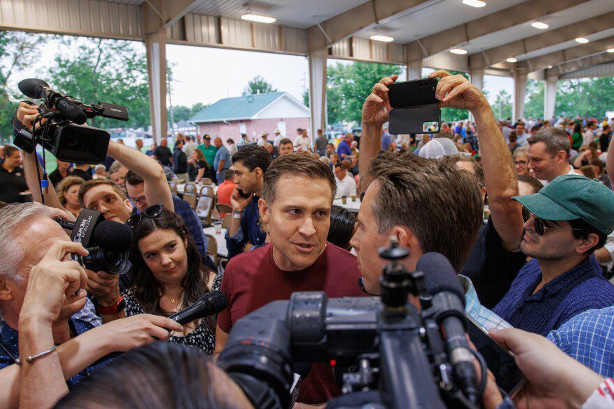 Lucas Kunce, left, and Josh Hawley, right, confront each other at the Governor’s Ham Breakfast starts in Sedalia on Thursday, August 15, 2024.