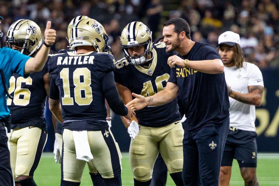 Aug 25, 2024; New Orleans, Louisiana, USA; New Orleans Sainte quarterback Derek Carr (4) and fullback Adam Prentice (46) congratulate quarterback Spencer Rattler (18) after passing a touchdown against the Tennessee Titans during the first half at Caesars Superdome. Mandatory Credit: Stephen Lew-USA TODAY Sports