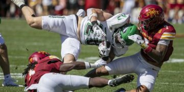 Iowa State Cyclones defensive back Malik Verdon (7) and Iowa State Cyclones defensive back Jontez Williams (3) pull down North Dakota Fighting Hawks running back Gaven Ziebarth (28) as he carries the ball in the first quarter at Jack Trice Stadium in Ames, Iowa on Saturday, Aug. 31, 2024. (Savannah Blake/The Gazette)