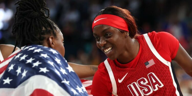 PARIS, FRANCE - AUGUST 11: Jackie Young #13, Kahleah Copper #7, and Chelsea Gray #8 of Team United States celebrate after their team's victory against Team France during the Women's Gold Medal game between Team France and Team United States on day sixteen of the Olympic Games Paris 2024 at Bercy Arena on August 11, 2024 in Paris, France. (Photo by Gregory Shamus/Getty Images) ORG XMIT: 776138675 ORIG FILE ID: 2166338621