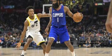 James Harden (1) handles the ball in front of Utah Jazz guard Collin Sexton