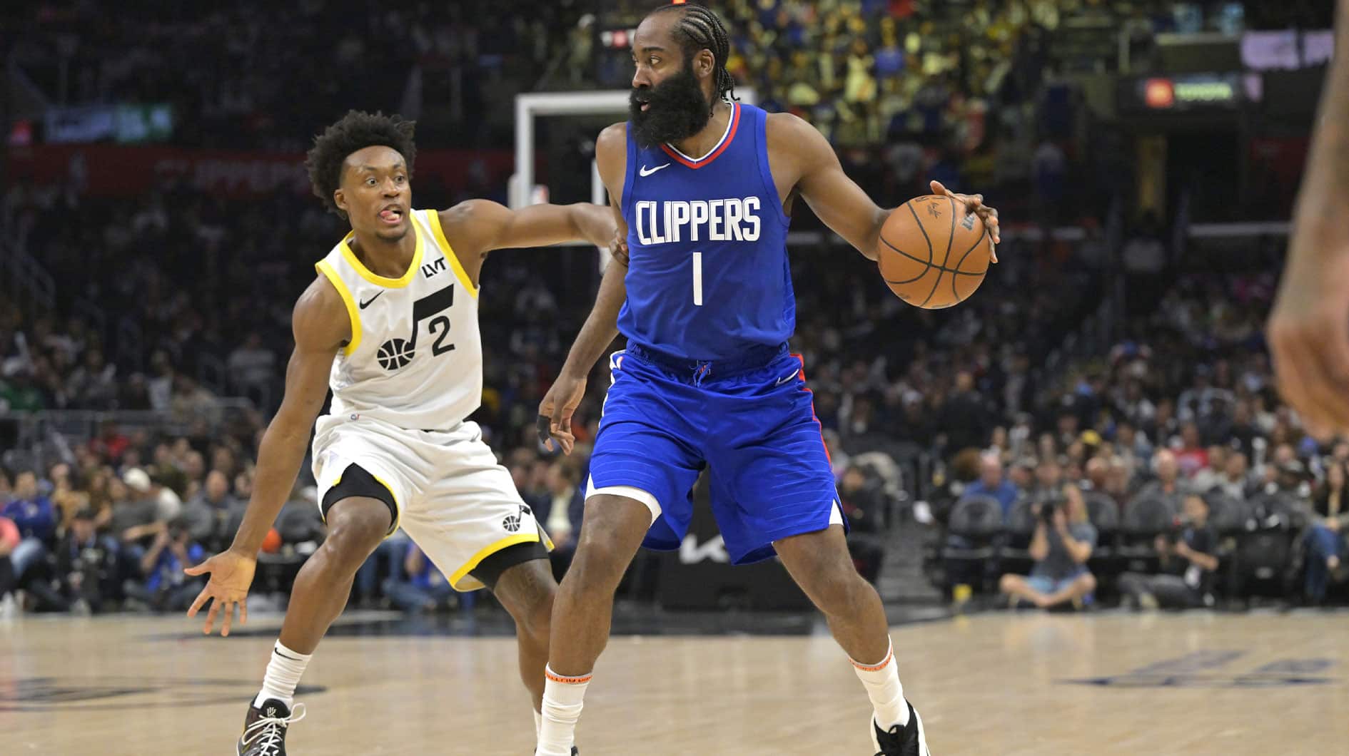 James Harden (1) handles the ball in front of Utah Jazz guard Collin Sexton