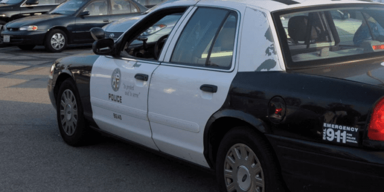 A patrol car in Los Angeles Police Department where homicide detectives there are investigating after a 61-year-old doctor was found fatally shot outside the facility where he worked in Southern California on Aug. 23, 2024.