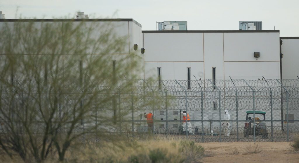 Saguaro Correctional Facility. People walking around inside of fences. Eloy, Arizona 6 march 2016. photograph Cory Lum/Civil Beat