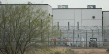 Saguaro Correctional Facility. People walking around inside of fences. Eloy, Arizona 6 march 2016. photograph Cory Lum/Civil Beat