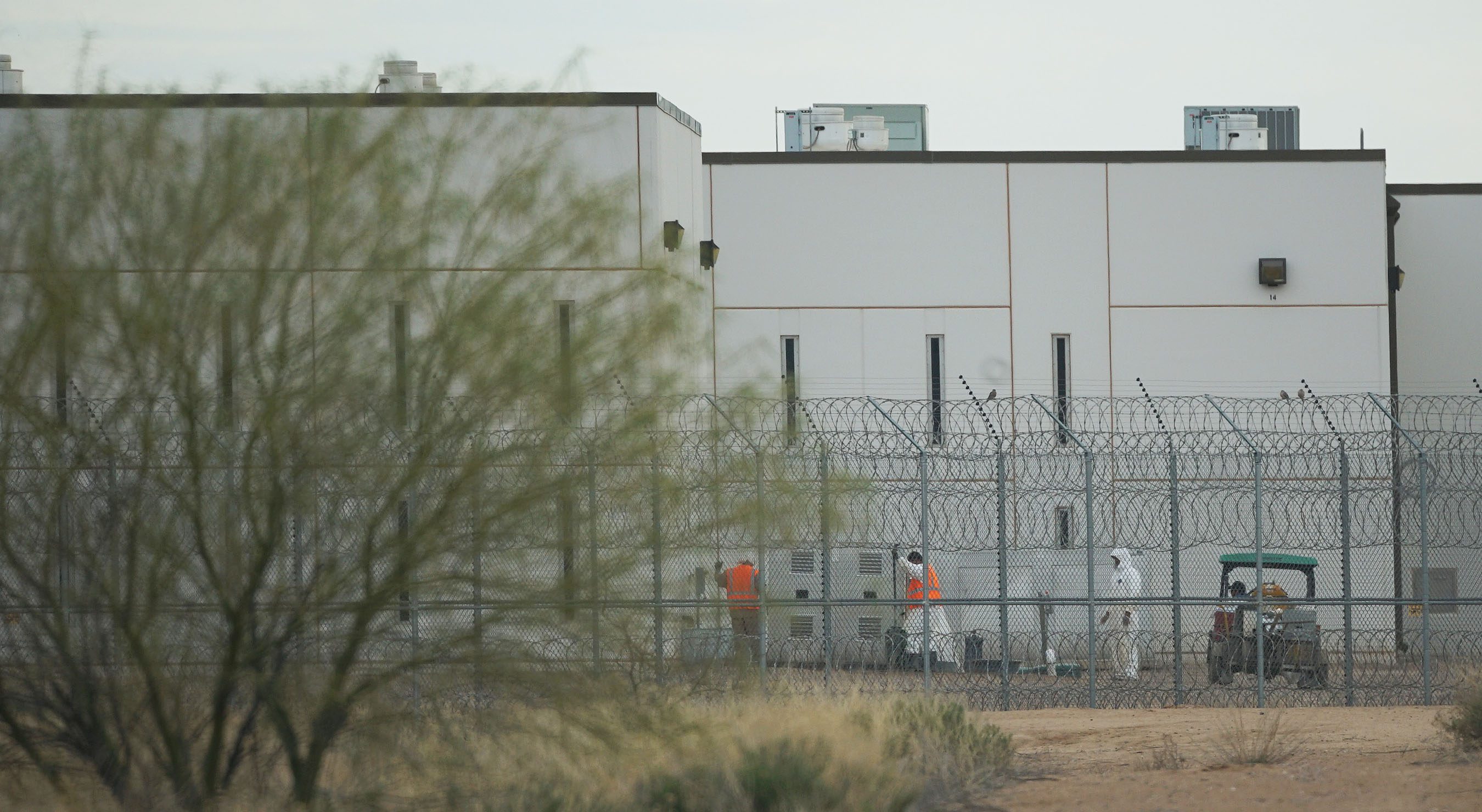 Saguaro Correctional Facility. People walking around inside of fences. Eloy, Arizona 6 march 2016. photograph Cory Lum/Civil Beat