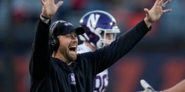 Northwestern head coach David Braun throws up his hands after Illinois offensive lineman Dom D'Antonio recovered a fumble to score a touchdown during the first half of an NCAA college football game, Saturday, Nov. 25, 2023, in Champaign, Ill.